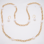 Juego de aretes y collar largo de baño de oro 18k con perla cultivada