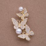 Prendedor de mariposas con perlas