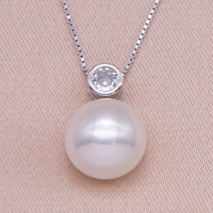 Juego cadena y dije de plata con perla cultivada y circón biselado