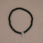 Pulsera de black spinel con dije de cruz