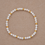 Pulsera perla cultivada y beads dorados
