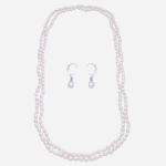 Juego de collar largo y aretes en perla oval