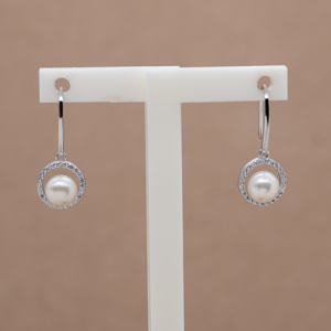 Aretes largos con perla natural y circones diseño circulo