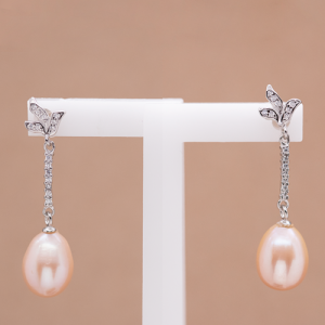 Aretes largos de perla oval rosada