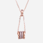 Juego de cadena con dije de plata con baño de oro rosado, diseño de 2 cilindros con espiral de circones