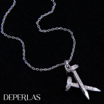 Juego de cadena con dije de 2 clavos con circones